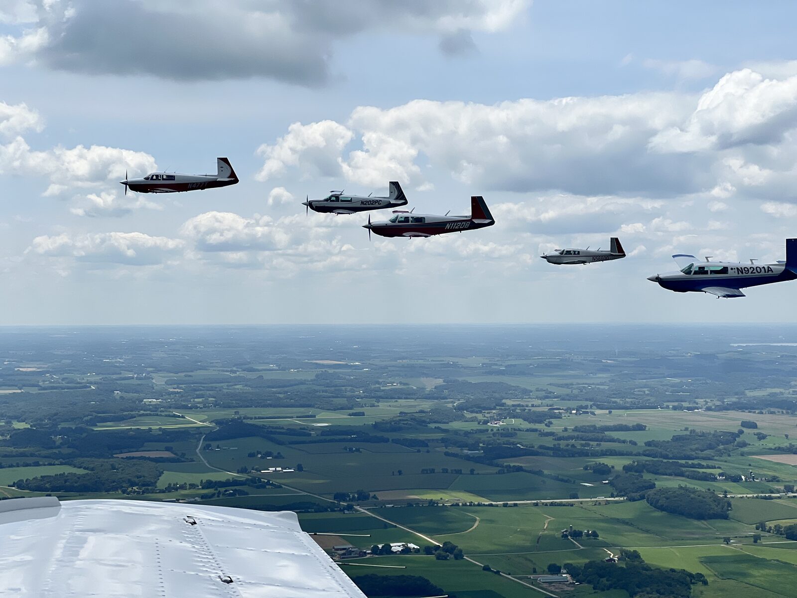 Mooneys in echelon formation during the Mooney Caravan, viewed from above