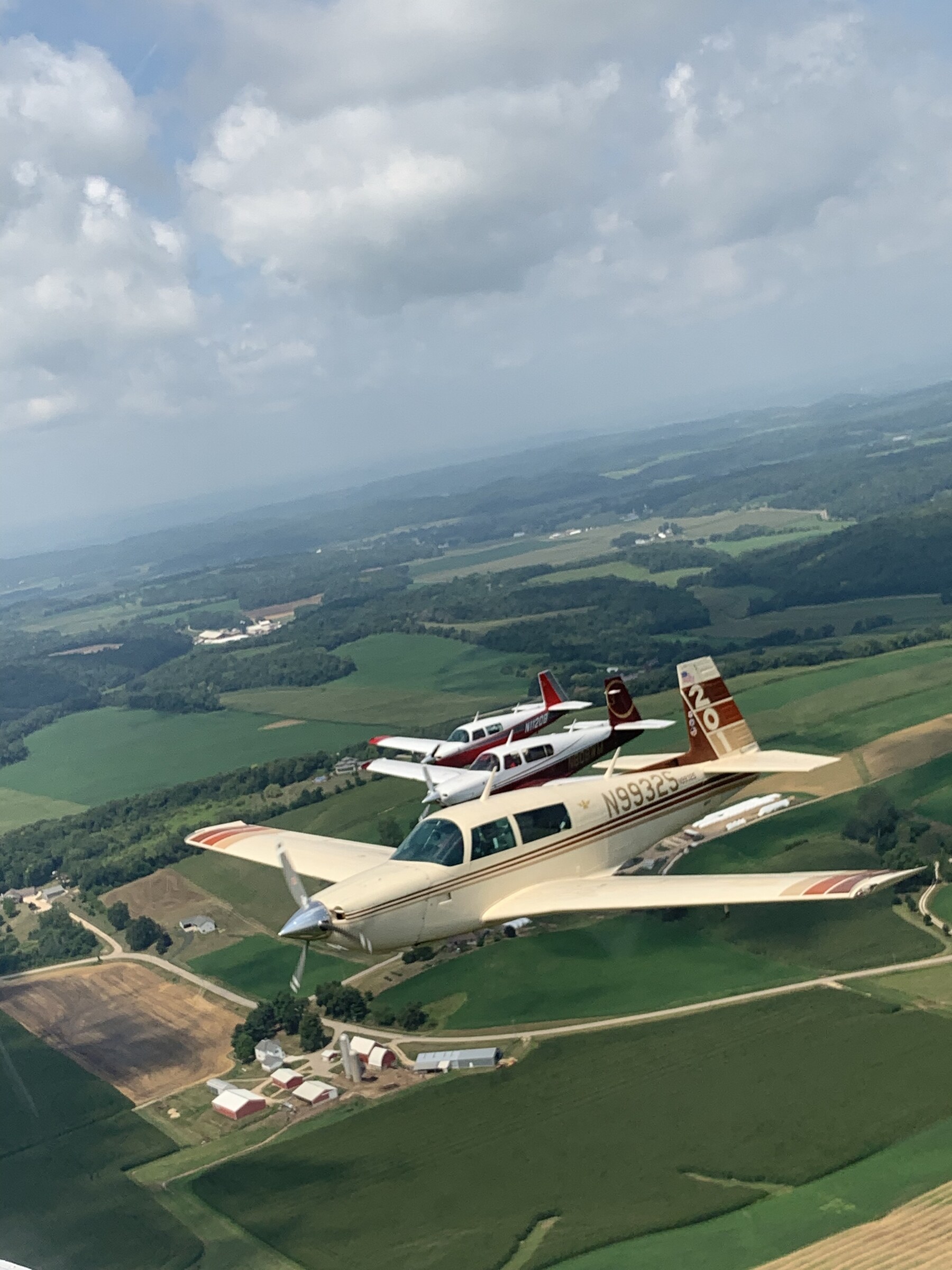 Three Mooneys in close formation, viewed from above