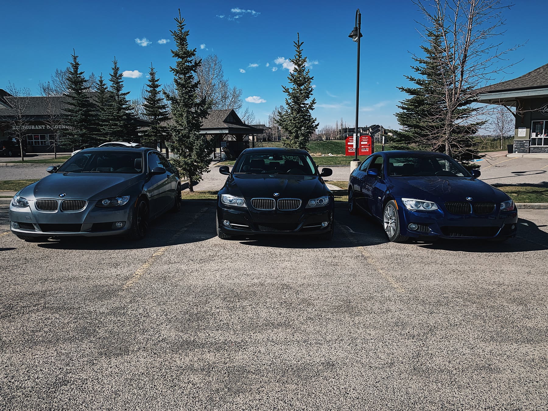 Three BMWs parked together