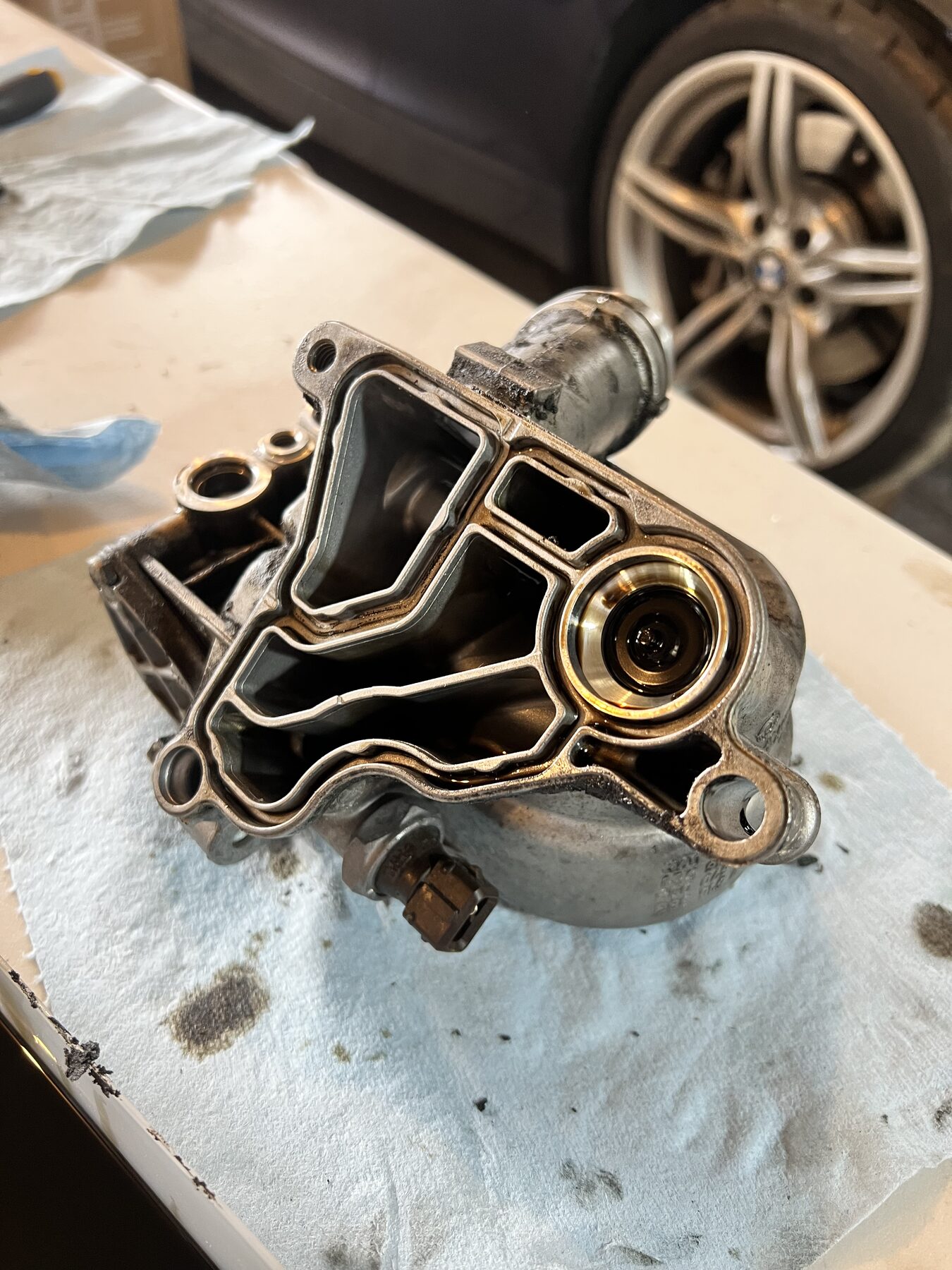 Cleaned underside of the housing, oil galleries visible, Z4 wheel in the background.